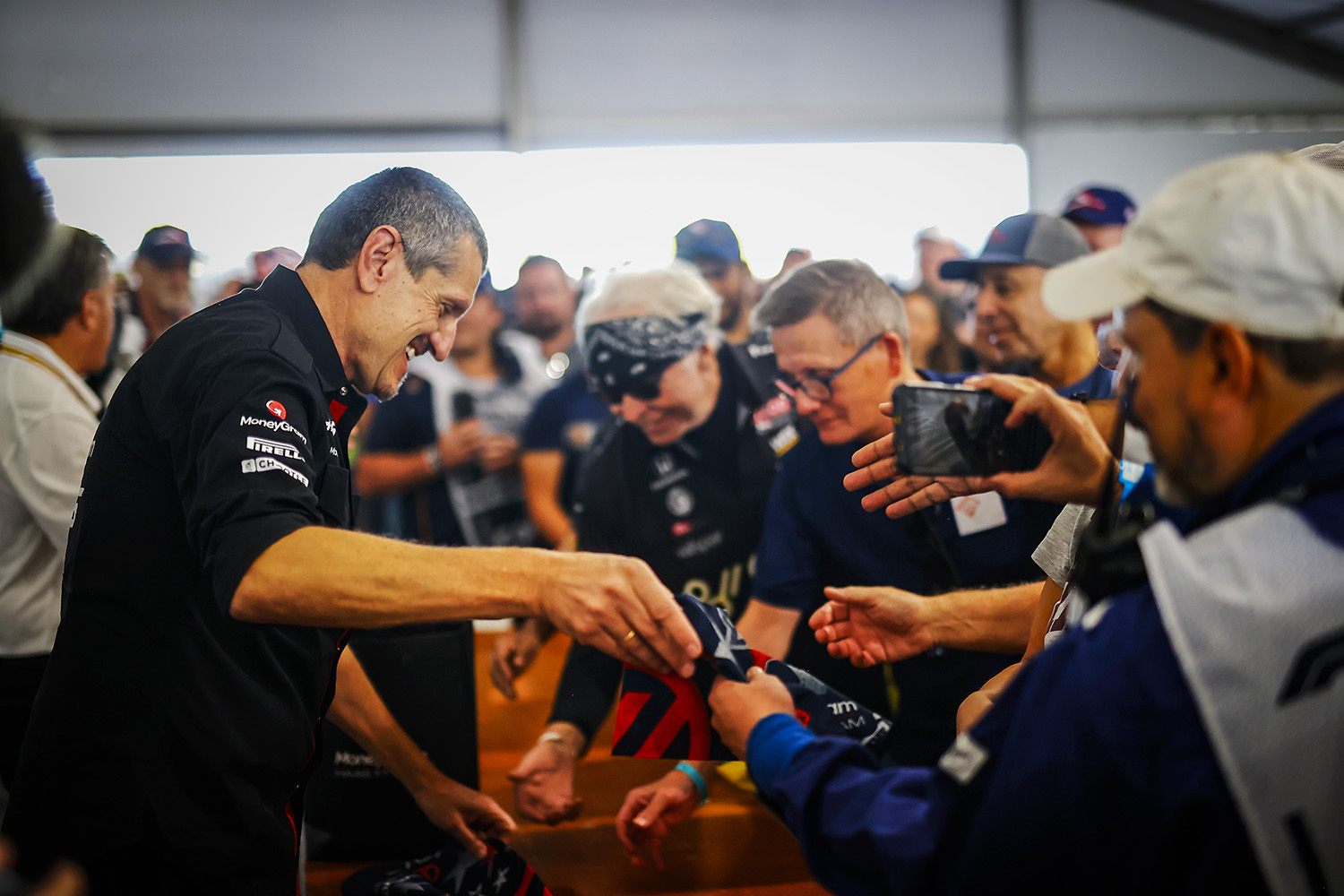 Guenther Steiner with Marshals in Austin